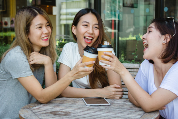 Cheerful Asian Young Women Sitting Cafe Drinking Coffee With Friends Talking Together_7861 842