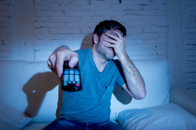 Man Watching Horror Movie Television Blocking His Eyes Scared