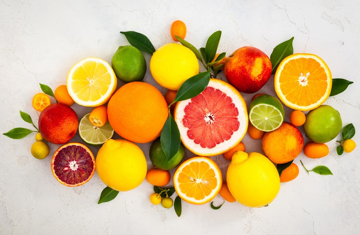 Assorted Fresh Citrus Fruits With Leaves