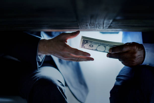 Hands Passing Money Under Table Corruption Bribery