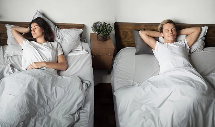 A_couple_practicing_sleep_divorce