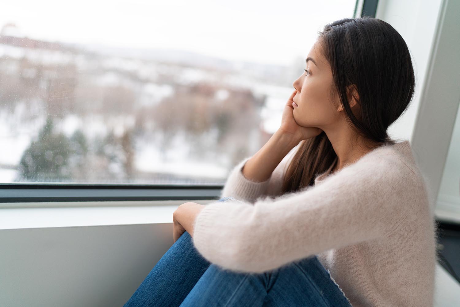 Winter Seasonal Affective Disored SAD Depression Mood Alone Asian Girl Feeling Lonely Stress, Anxiety, Melancholy Emotions. Sadness At Home.